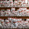 Patung Maneki-Neko yang memenuhi rak kuil (GaijinPot).