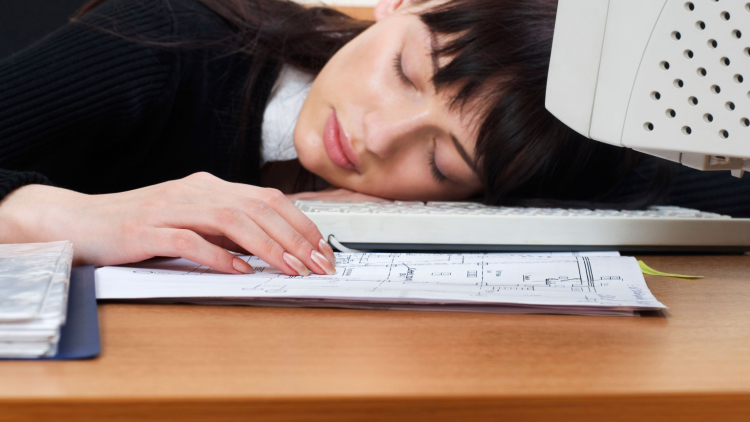 Woman asleep at computer