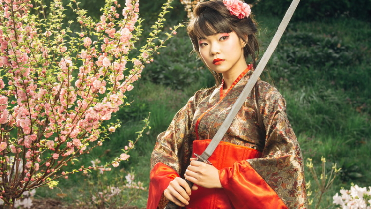 Beautiful geisha in kimono with samurai sword Beautiful geisha in kimono with samurai sword
