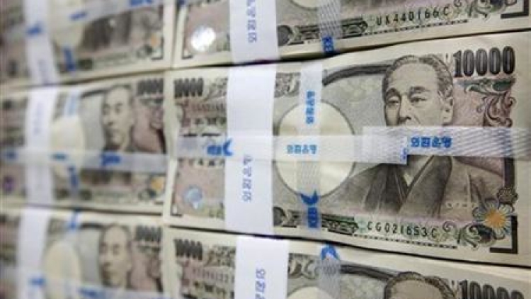 Japanese yen notes are piled up after counting at a bank during a photo opportunity in Seoul